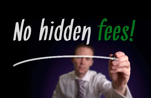 A salesman writing no hidden fees policy