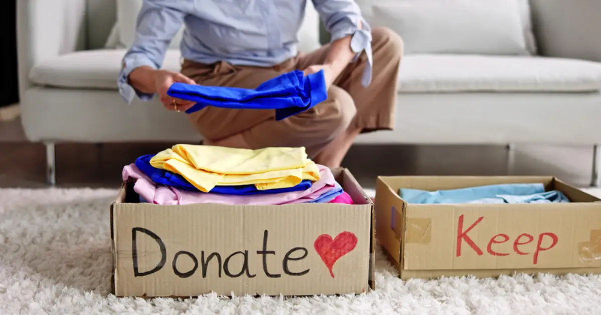 a woman decluttering her belongings in order to manage her relocation more smoothly