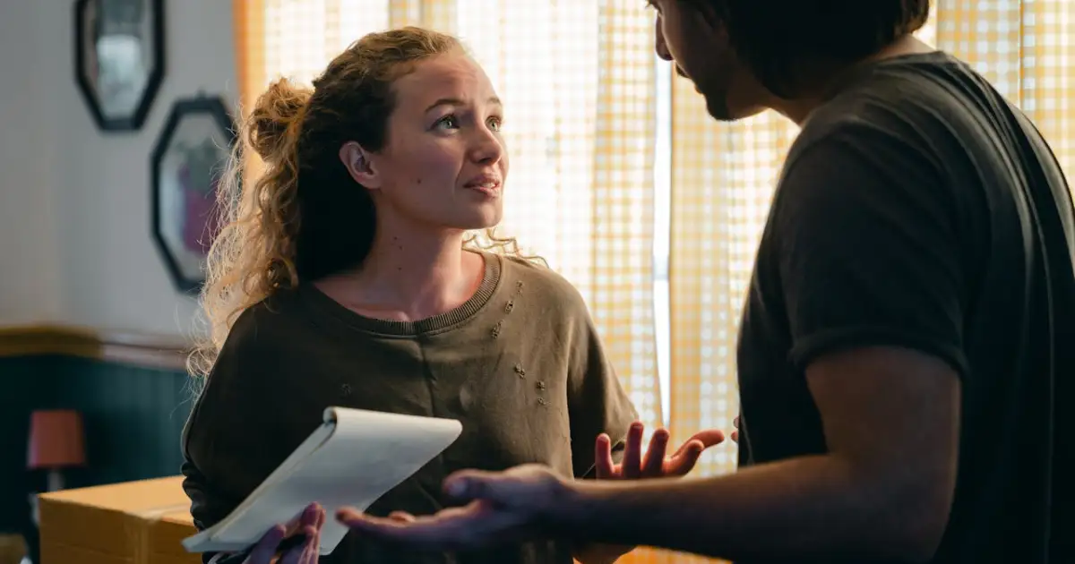 worried couple with a notebook encountering a problem with their moving plans